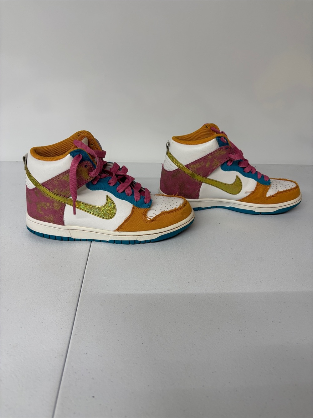 Nike sneaker interior in mustard, pink, white and blue